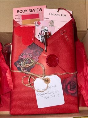 Red blind date with a book box bundle pans, markers book bracelet, notebook lots